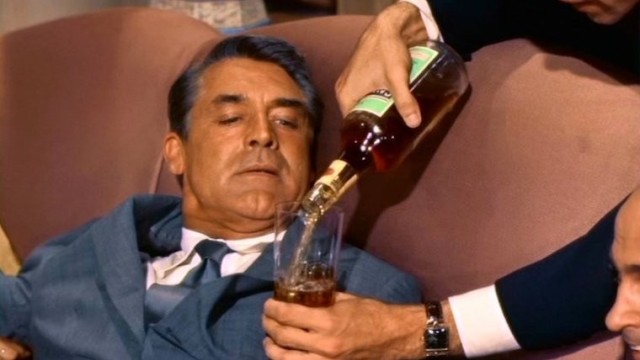 north-by-northwest-1959-001-cary-grant-forced-to-drink-tumbler-full-of-whiskey
